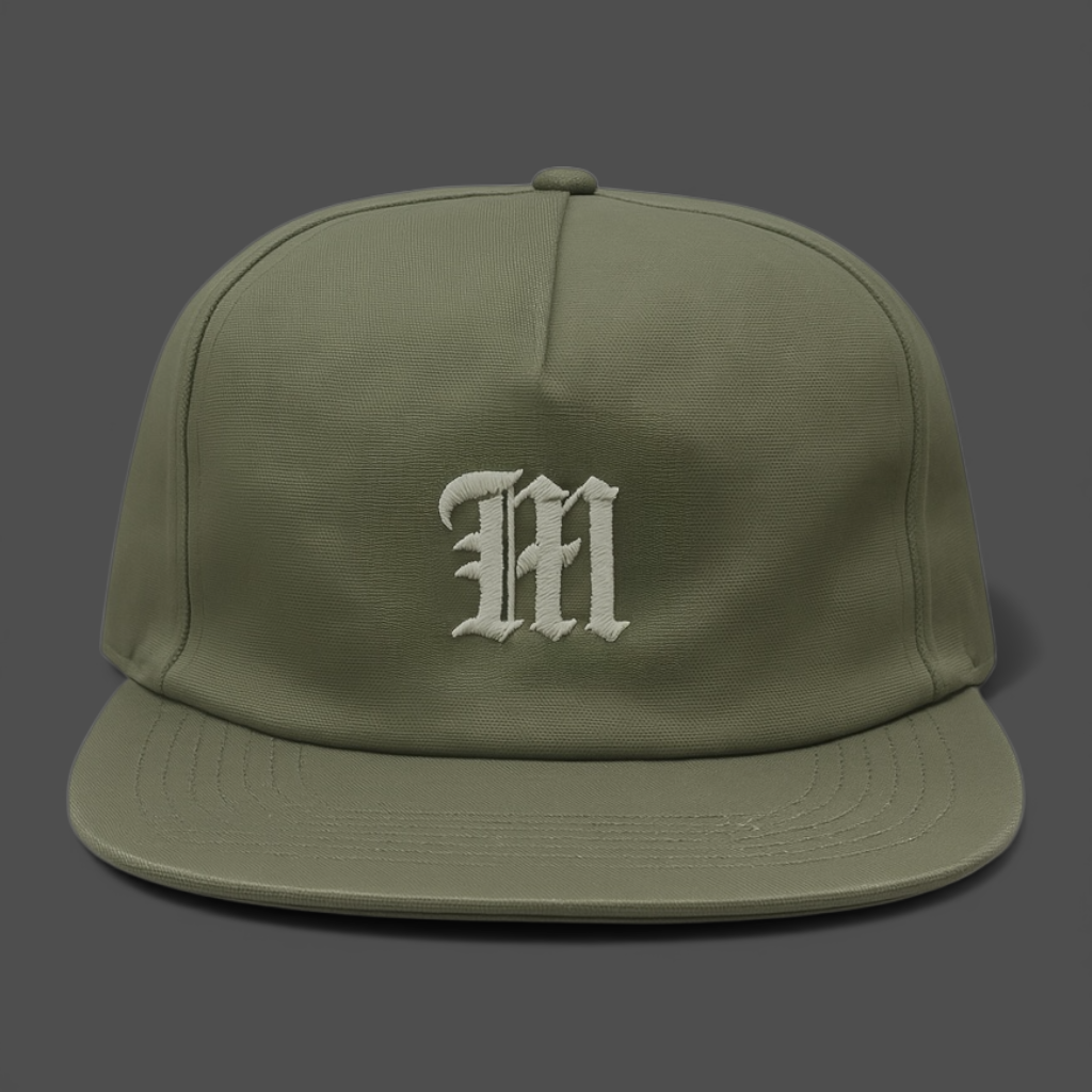 Green cap with a white 'M' logo on a gray background