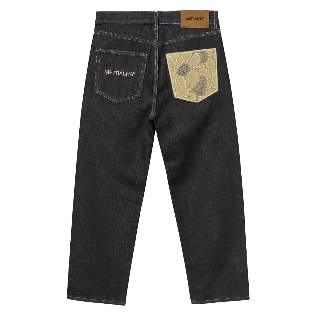 Black denim jeans with a brand logo on the back pocket against a dark gray background