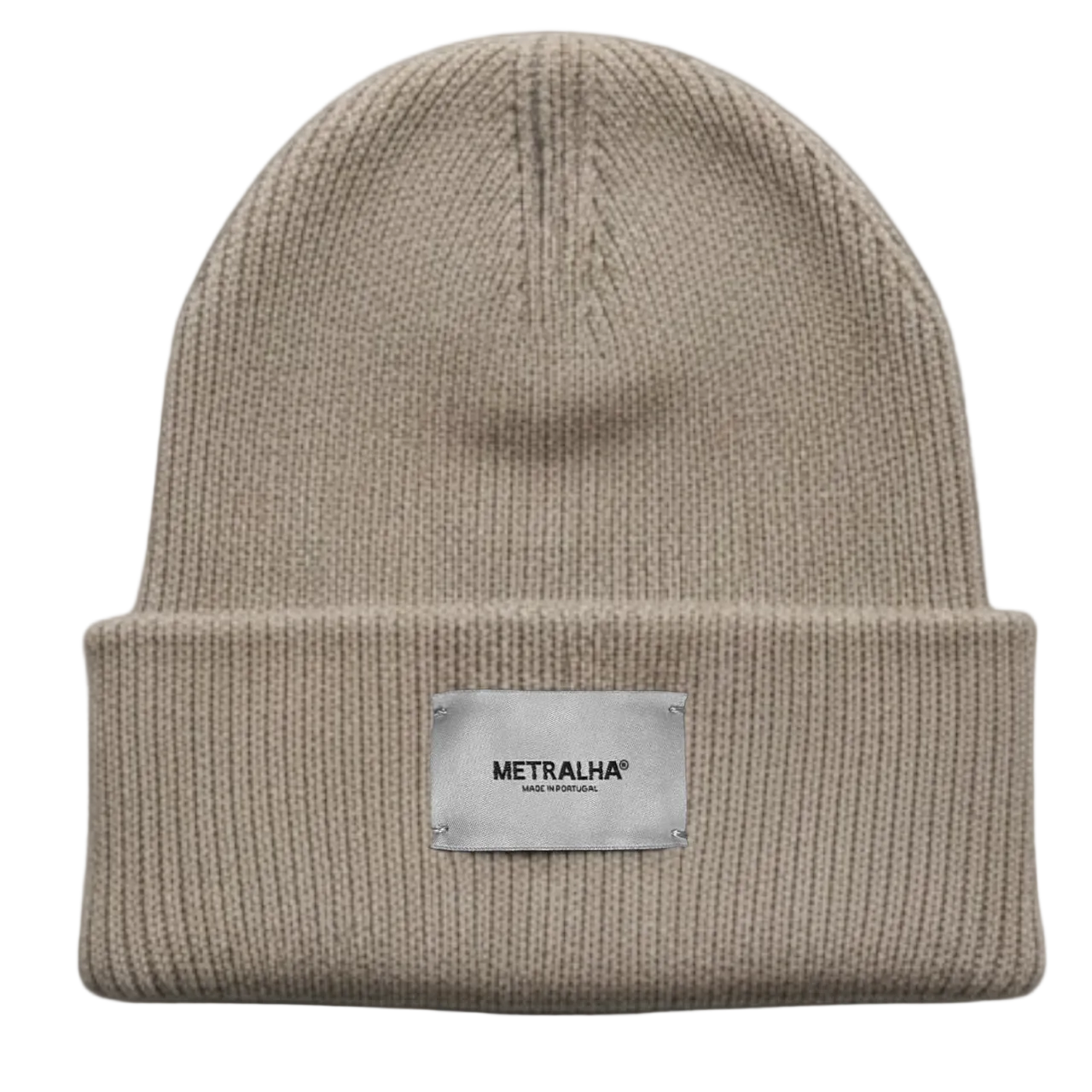 Beige knit beanie with a silver label on a dark gray background