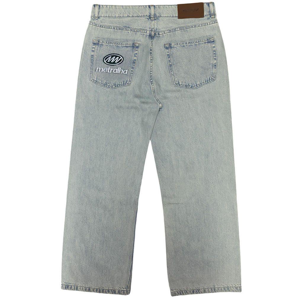 Light blue denim jeans with a brand logo on the back pocket against a gray background