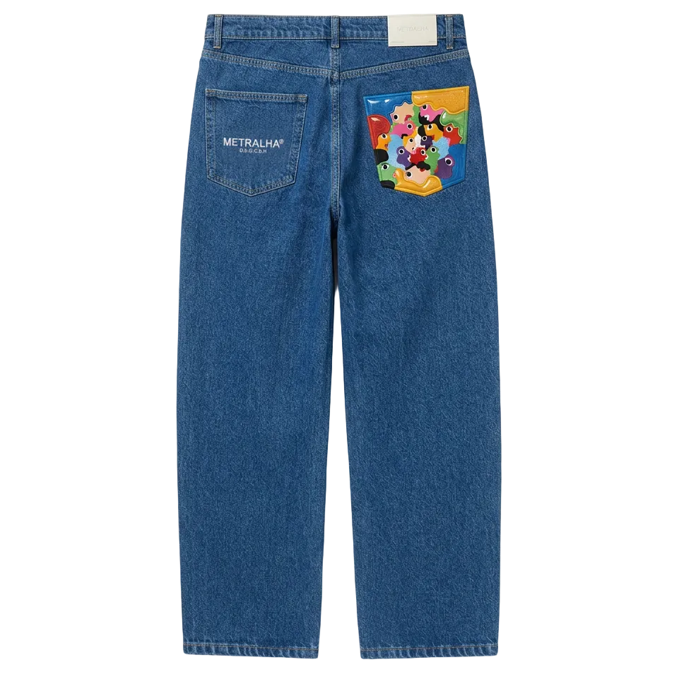 Blue jeans with a colorful patch on the back pocket against a white background