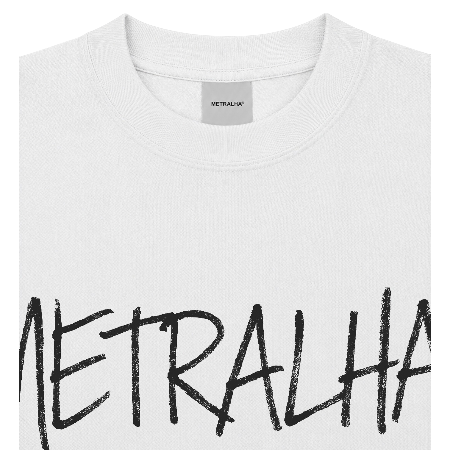 White crewneck t-shirt with a black brush-stroke style graphic reading 'METRALHAR' across the chest, shown in a close-up view.